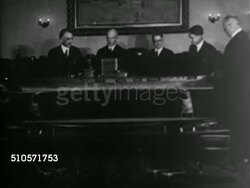 1922: US CARRIER CONVERSION: TU WS Navy Department building, Rear Admiral David Taylor, Congressman Hicks, Rear Admiral William A. Moffet, Congressmen Burdick & Swing, Rear Admiral John K. Robinson placing aircraft carrier model over battle cruiser. Instructional Video