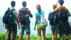 Group of hikers at top of the hill,enjoying panorama. Stock Footage