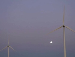 Two Wind Turbines and Full Moon Stock Footage