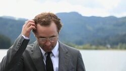 A businessman scratches his head and curses. Stock Footage