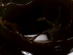 CU SLO MO Sugar falling into bowl of coffee / Vieux Pont, Normandy, France  Stock Footage