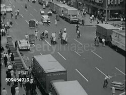 1963: NEW YORK CITY GARMENT DISTRICT:  HA XWS Avenue bustling w/ activity, people walking sidewalk & street intersection, traffic, racks, boxes, carts. Iconic, fashion, design, street scene, Chelsea neighborhood. Instructional Video