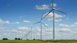 Tracking shot of Windfarm. Summer. Stock Footage