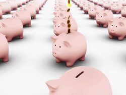 coins fall in single file into piggy bank amid an army of piggy banks Stock Footage