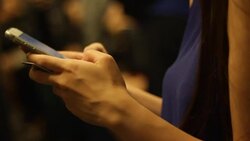 Crowded people in the mass public transportation using typing phone Stock Footage