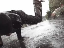 HD Super Slow-Mo: B-Boy Dancing In The Rain Stock Footage