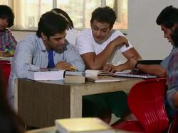 Group of college students studying in library Stock Footage