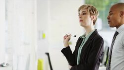 Business people having meeting at whiteboard Stock Footage