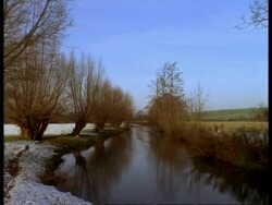 T/L River Windrush in snow, December, Lapse time Stock Footage