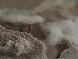 CU Water foaming on salt deposit edge of lake / Republic of Djibouti Stock Footage