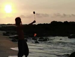 MS Silhuoette of rasta man spinning fire on beach with sunrised / Montezuma, Punteranes, Costa Rica Stock Footage