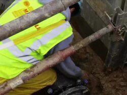 Construction Workers Lay Water Pipe Underground Stock Footage