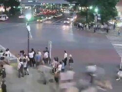WS T/L View of pedestrian traffic and busy street near Shibuya station at dusk / Shibuya, Tokyo, Japan Stock Footage