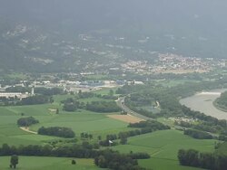 WS AERIAL View of highway and farmhouse with mountains / Rhone Alpes, France Stock Footage