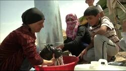 Syrian Kurds continue to cross the border into Iraqi Kurdistan to seek refuge from war News Clip