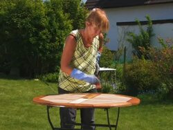 PAL:Coating the garden table Stock Footage
