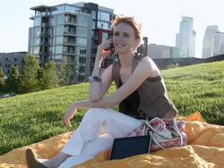MS Young girl using cellular device outside in urban park smiling and having fun / Minneapolis, Minnesota, United States Stock Footage