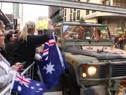 Mid shot of approaching SUV with soldiers and a Stock Footage