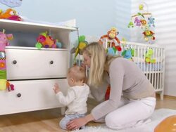 HD DOLLY: Mother and Her Baby Exploring The Drawer Stock Footage