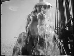 B/W 1955 man in protective clothing showering after fuelling Nike missile / near Seattle / newsreel Stock Footage