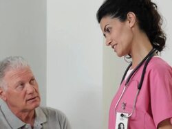 "TD hispanic medical worker talking to a senior patient and her husband in the hospital/Richmond,Virginia, USA" Stock Footage