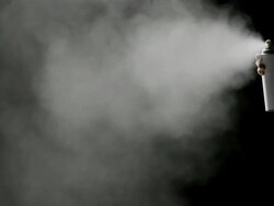 Spraying on black background Stock Footage