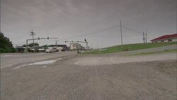 Cars turn left at a suburban intersection. Stock Footage