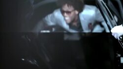 Hip-hop star bounces out of limousine, signs autographs, and twirls on red carpet at awards show Stock Footage