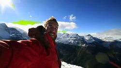 Hiker takes 360 degree view selfie on mountain top Stock Footage