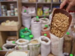 In the grocery. Taking rye flakes from sack Stock Footage