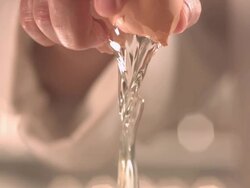 Chef's hand cracking an egg Stock Footage