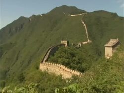 WA Great Wall snaking up hill, zoom in to tourists on staircase, Great Wall of China, Mutianyu, China Stock Footage