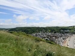 HD panning shot: Etretat village and Aval cliff Normandy, France Stock Footage