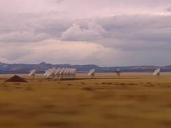 SIDE POV, Car driving through desert, passing Very Large Array, New Mexico, USA Stock Footage