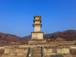 Shot of Keodonsajisamcheungseoktap stone pagoda(Korea Treasure 750) at Keodonsaji(Korea Historic Place 168) and clear sky Stock Footage