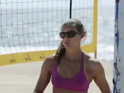 CU of a female beach volleyball player hand setting the ball. Stock Footage
