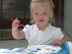 Little girl paints a picture. Stock Footage