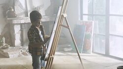 Little boy painting Stock Footage
