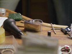 PAN a jeweller's work station Stock Footage