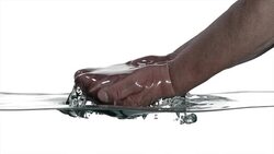 SLO MO of elder hands cupping water Stock Footage