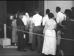 1923: HARDING FUNERAL: WS Long line of people, some w/ umbrellas, outside & up into Capitol Rotunda, MS People, women, children moving into Rotunda, MS President Warren G. Harding's coffin lying in State w/ people passing BG. HA WS Long line of people Instructional Video