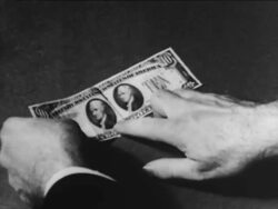 Comparing a counterfeit and genuine ten dollar bill Stock Footage