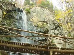 HD: Footbridge Over A Waterfall Stock Footage