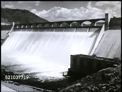 MOT 1945: COLUMBIA BASIN PROJECT: Angled WS Columbia River & white water rapids, MS White water rapids. Angled WS Grand Coulee Dam. VS Inside dam, large generator, man reading wall of gauges, making notes. TD Water sliding down damn wall Instructional Video