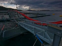 T/L clouds passing over fish farm, Japan Stock Footage