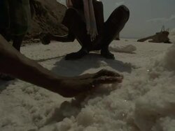 Medium Close Up tracking-right - Tribesmen gather salt in Djibouti. / Djibouti Stock Footage