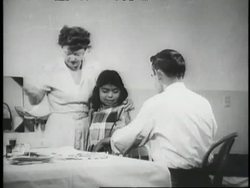 Doctors and nurses administer polio vaccinations to children. News Clip