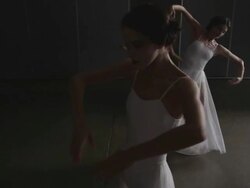 Three ballerinas performing arabesque Stock Footage