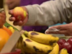 "CU of woman bagging fresh fruit at colourful market stall, Chachapoyas market, Chachapoyas, Peru [PerÃƒÂº]" Stock Footage