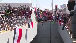 VOICED : Iraquies desafian al poder y protestan masivamente en Bagdad News Clip